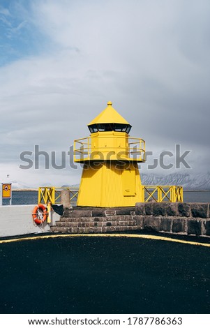 A large yellow lighthouse in Iceland, Reykjavik.