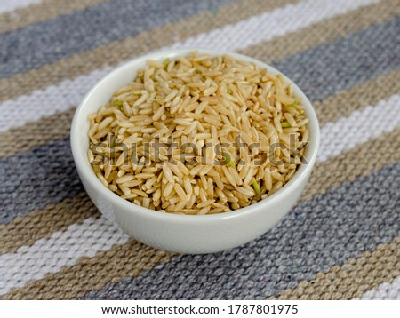 Bowl of organic brown rice.  Concept of heart healthy meal.  Horizontal view.