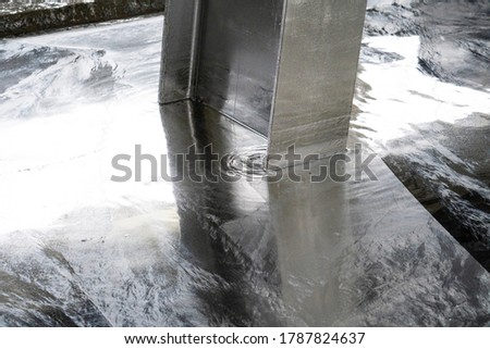 Galvanized parts. Galvanized industrial parts on a construction site. Galvanizing factory process. Galvanizing metal parts in galvanic workshop Royalty-Free Stock Photo #1787824637