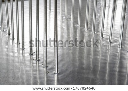 Galvanized parts. Galvanized industrial parts on a construction site. Galvanizing factory process. Galvanizing metal parts in galvanic workshop Royalty-Free Stock Photo #1787824640