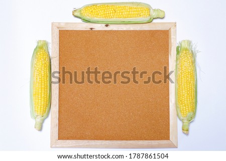 This is a picture of corn and a cork board.