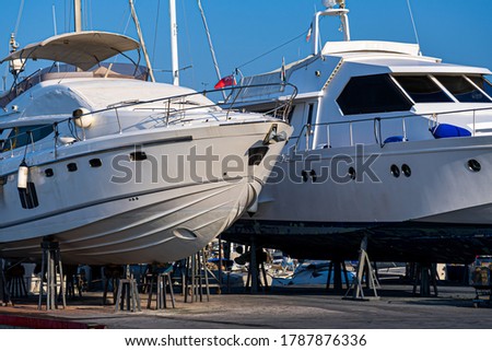 Yacht in the dry dock. Maintenance boat service on the mediterranean coast. Hight quality photo Royalty-Free Stock Photo #1787876336