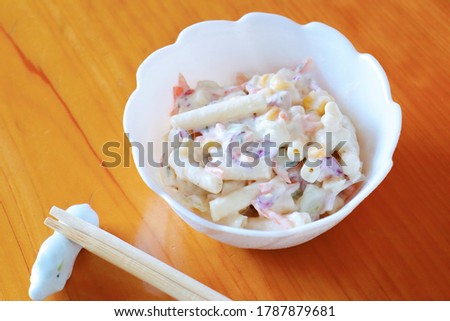 This is a picture of a macaroni salad with mayonnaise.