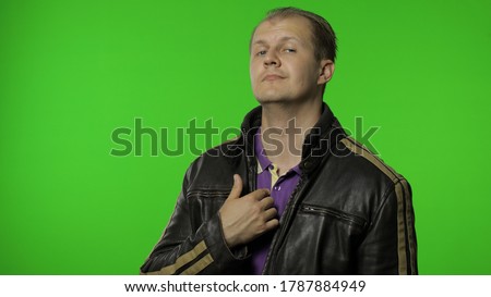This is me. Ambitious self-confident rocker man in leather jacket pointing himself and looking at camera with arrogance, expressing pride in his achievements. Guy biker on chroma key background