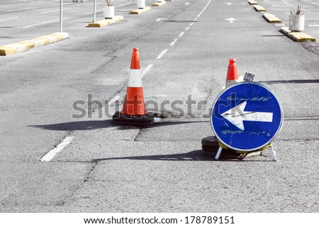 Road detour sign and cones due a pothole