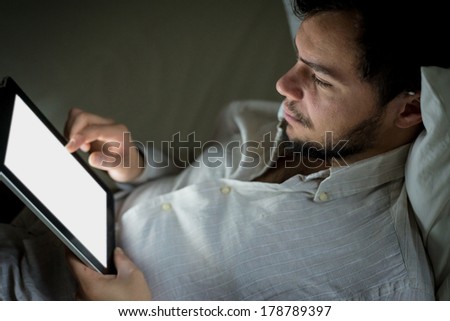 young stylish man lifestyle using tablet at home