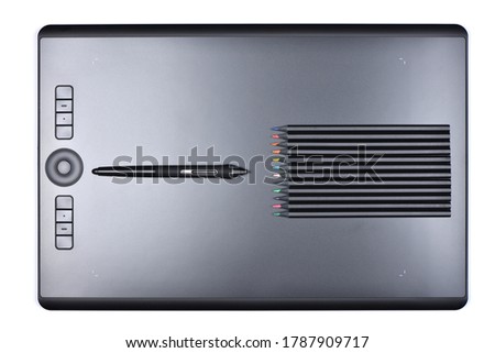 Top view professional graphics tablet with multicolored and digitized pens. Isolated on white background. High resolution photo. Full depth of field.