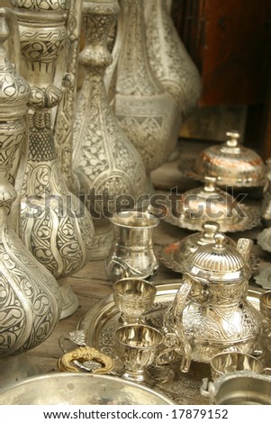 Ottoman tea set between silver ottoman bottles and objects