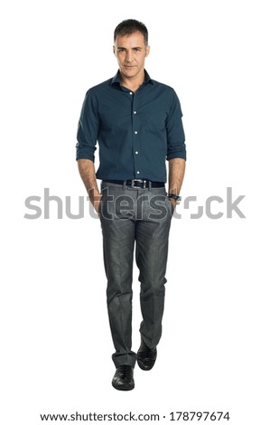 Serene Man Walking With Hand In Pocket Isolated On White Background
