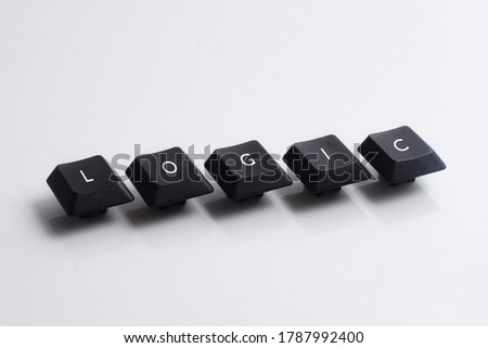 Logic word on black cube with white background