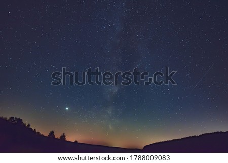 Milky Way and satellite  in the night.