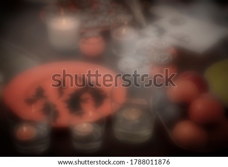blurred halloween table.  candles, smoke