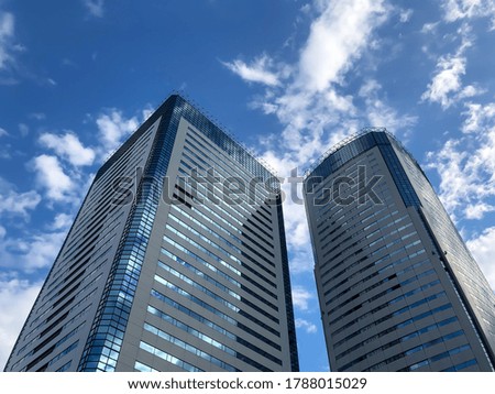 Skyscrapers under the blue sky with clouds in Tokyo summer