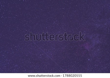 Milky Way and satellite  in the night sky.