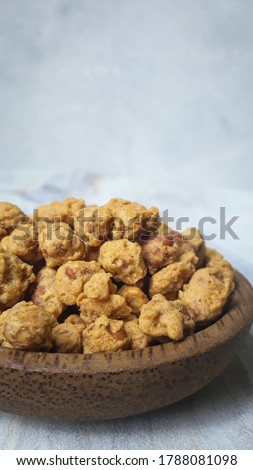 Kacang telur Medan or Medan Egg Beans are a nut-based snack with crispy flour mixed Royalty-Free Stock Photo #1788081098