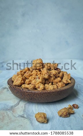 Kacang telur Medan or Medan Egg Beans are a nut-based snack with crispy flour. Selective focus  Royalty-Free Stock Photo #1788085538