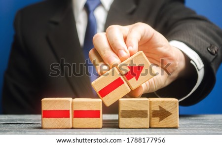Businessman is building an alternative path. Revision of the strategy and process changes. Improvement, modernization. Flexibility and business adaptation to new conditions. Rethinking old approaches. Royalty-Free Stock Photo #1788177956