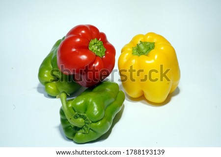 Fresh Capsicum of 3 color stock photo. Capsicum in different colors, red, yellow, green and