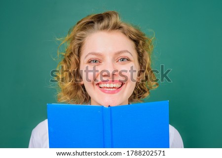 Smiling teacher. Back to school. Close up portrait of teacher with books. Funny teacher. School subjects. Education. School. Job. Teacher in classroom.