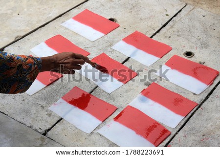 Making red and white flag attributes to welcome the independence of the Republic of Indonesia.