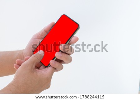 Side view of hand hold smartphone with blank screen for mockup advertising