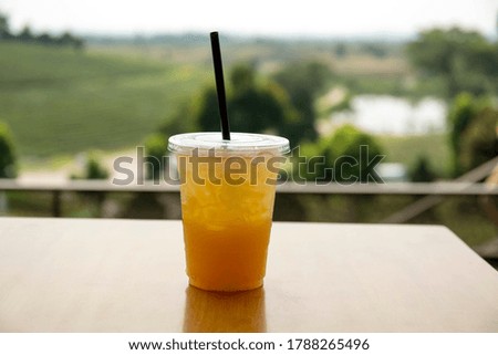 Lemon ice tea with table background next to garden tea
