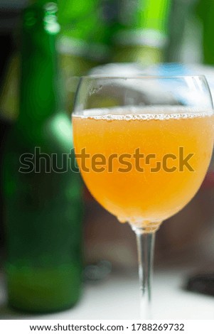 small bubbles in glass with craft beer on blurred background