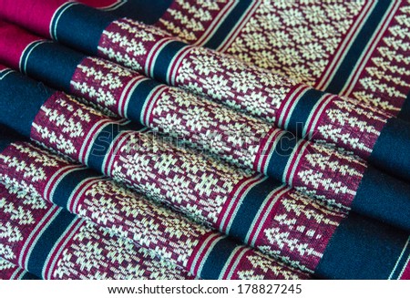 Fabric pattern on purple silk background