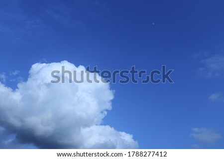 White cumulus clouds in blue sky

