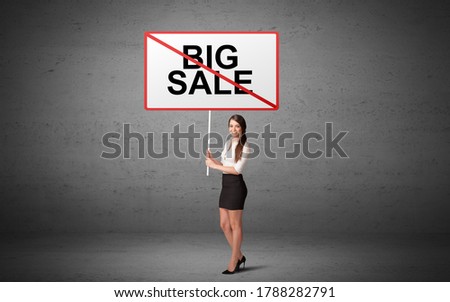 business person holding a traffic sign with BIG SALE inscription, new idea concept