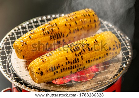 Corn on a charcoal stove