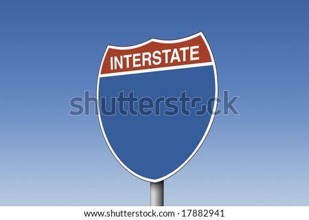 Empty interstate sign against blue sky