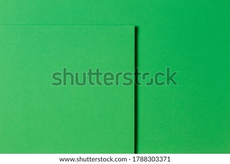 Abstract green monochrome creative paper texture background. Minimal geometric shapes and lines
