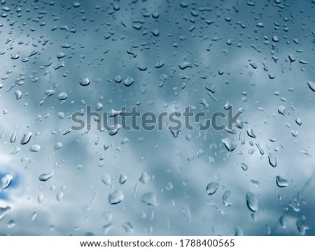 Water droplets on the glass with a background