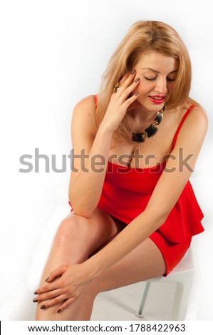Fashion portrait of a beautiful young Asian woman in a red dress. Funky fresh and playful reusable Asian Chinese / Caucasian woman smiling happy and joyful
