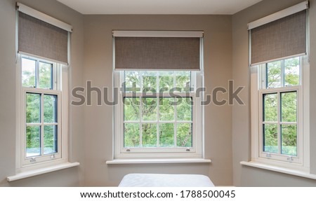 pretty windows with blinds in a house  Royalty-Free Stock Photo #1788500045