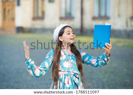 Girl student inspired reading recite poetry, literature lesson concept. Royalty-Free Stock Photo #1788511097