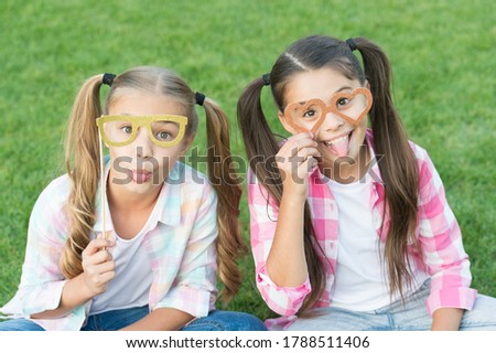 Carefree kids photo booth props funny eyewear outdoors, summer holidays concept.