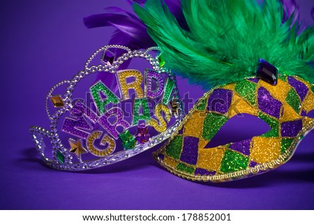 Festive Grouping of mardi gras, venetian or carnivale mask on a purple background