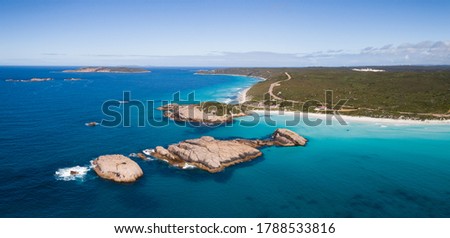 Twilight Beach in Esperance Western Australia offers stunning turquoise waters and a magical coastline with Twilight Island - a popular swimming rock where people jump off and enjoy the summer heat. Royalty-Free Stock Photo #1788533816
