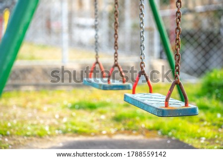 Swing seat in the park Royalty-Free Stock Photo #1788559142