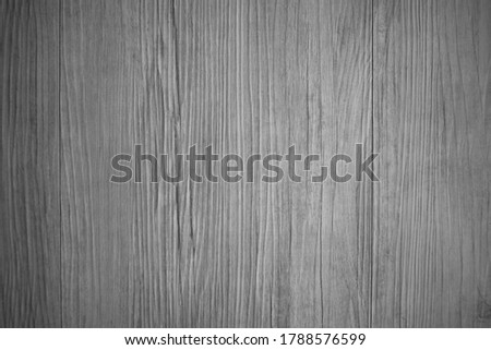 Wooden wall with texture and grain in dark black and white tone for background and decoration Cool banner on page and cover