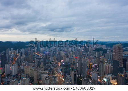 Aerial view of modern city and mountains