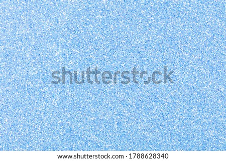 Glitter background for design view, texture in attractive light blue tone. High resolution photo.