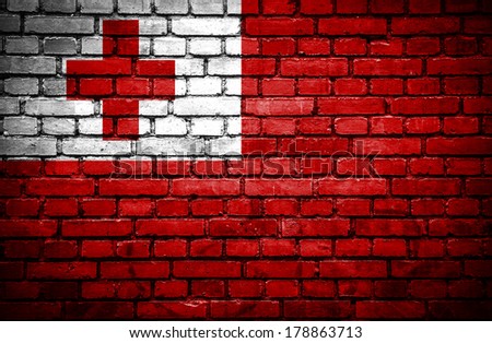 Brick wall with painted flag of Tonga