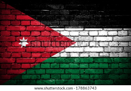 Brick wall with painted flag of Jordan