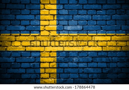 Brick wall with painted flag of Sweden