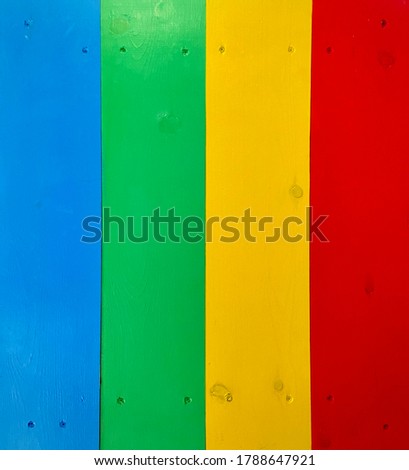 Wood boards painted as a rainbow for children's table or desk.