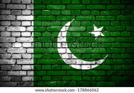 Brick wall with painted flag of Pakistan