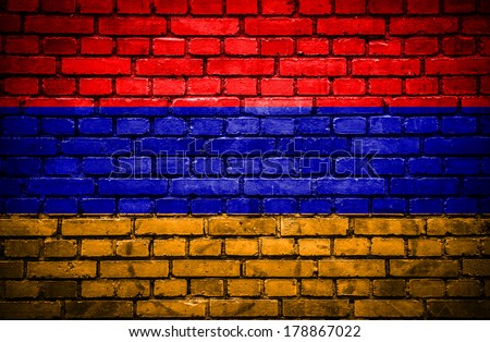 Brick wall with painted flag of Armenia